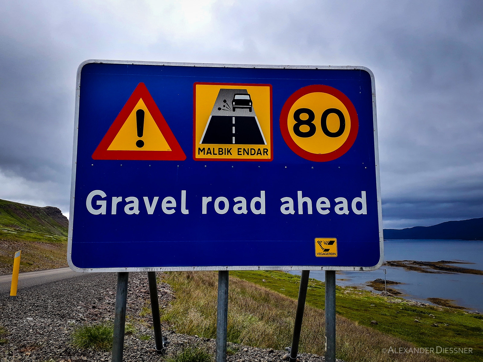 Gravel road sign island