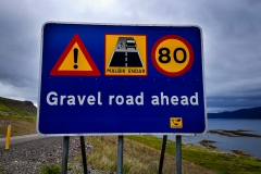 Gravel road sign island